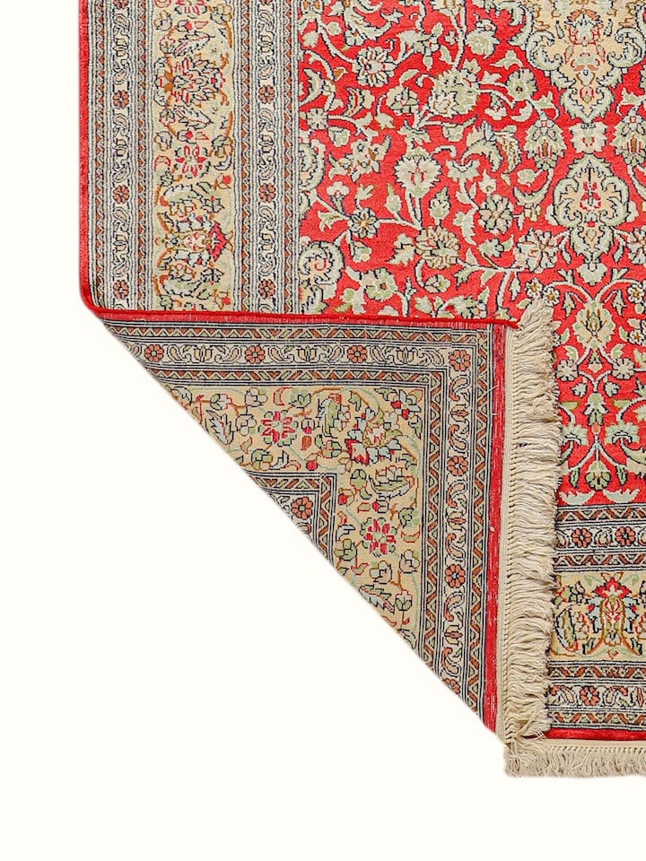 Detailed view of the Traditional Persian Navy Ochre Tabriz Kashmir Silk Hand-Knotted Carpet craftsmanship
