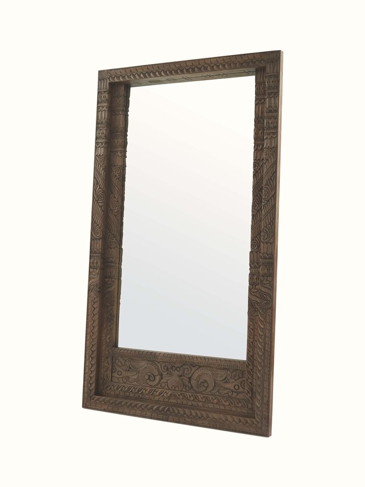Angled view of the Carved Mango Wood Full Length Mirror