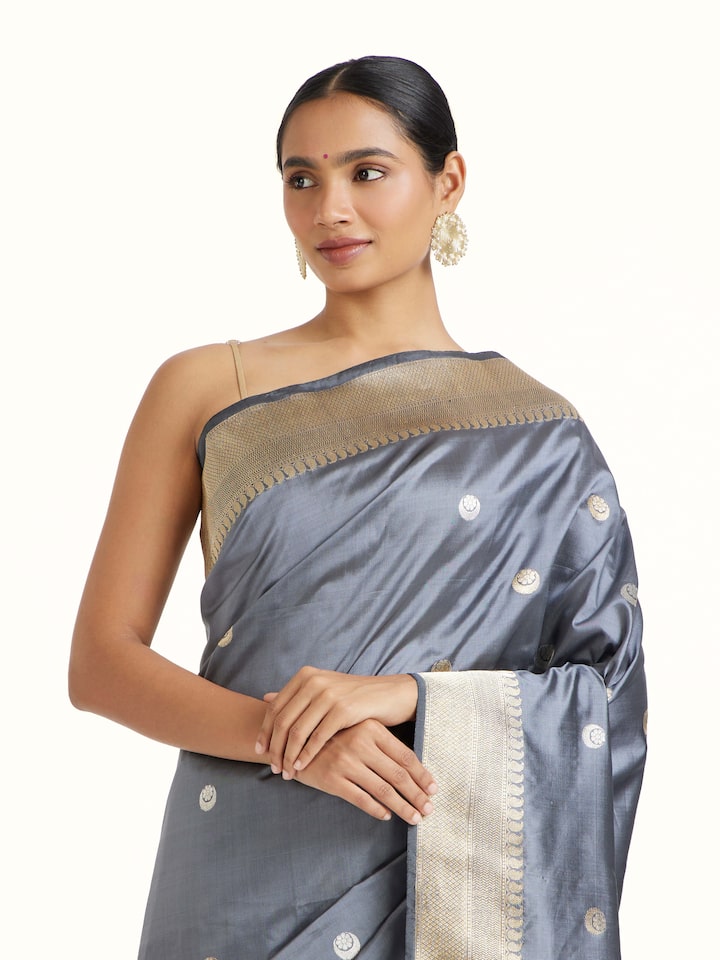 Angled view of Grey Mulberry Silk Banarasi Saree revealing the depth of its color and intricate pattern