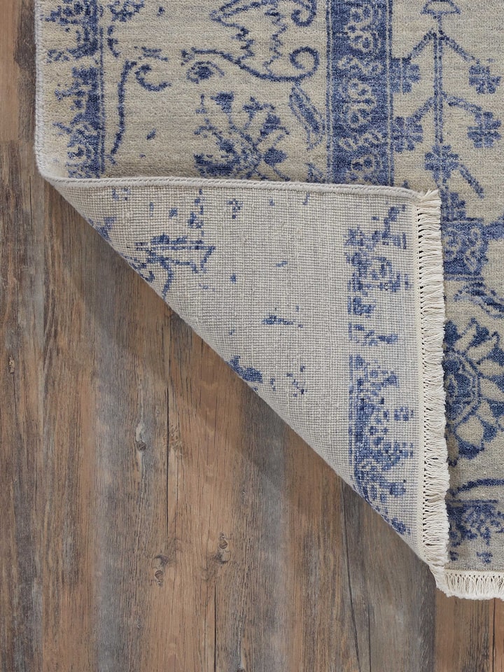 Full view of Distressed Transitional Grey Blue Agra wool & viscose hand-knotted rug spread out to show its design and size