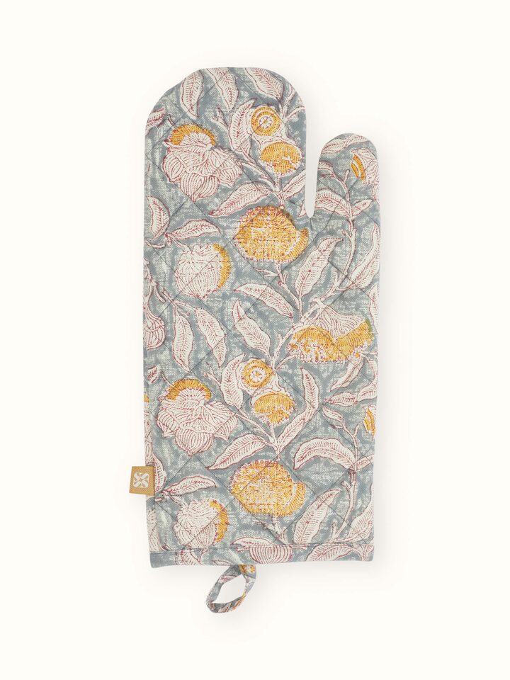Side view showing pair of hand block printed cotton mitts in elegant grey floral pattern.