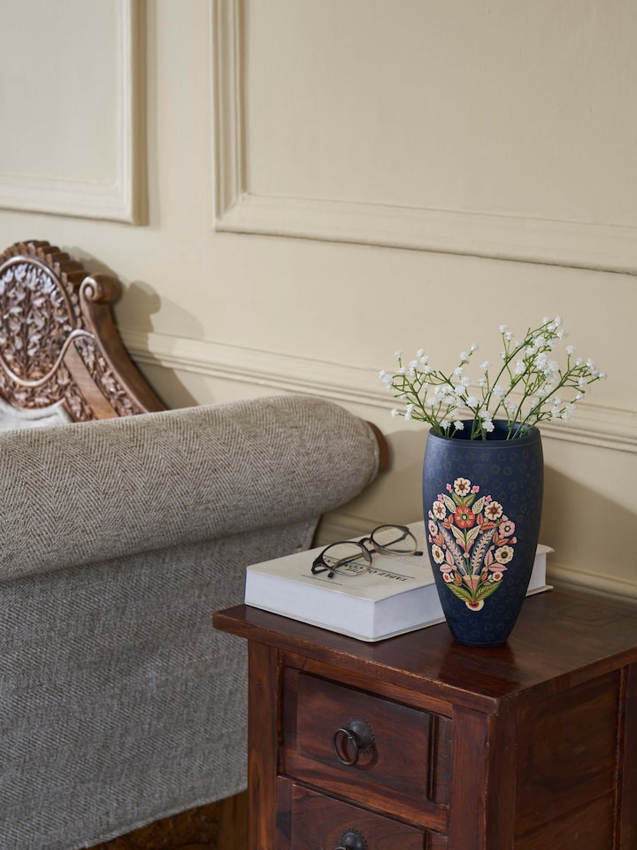 Side view of Papier-mache chinar table vase with fine detailing