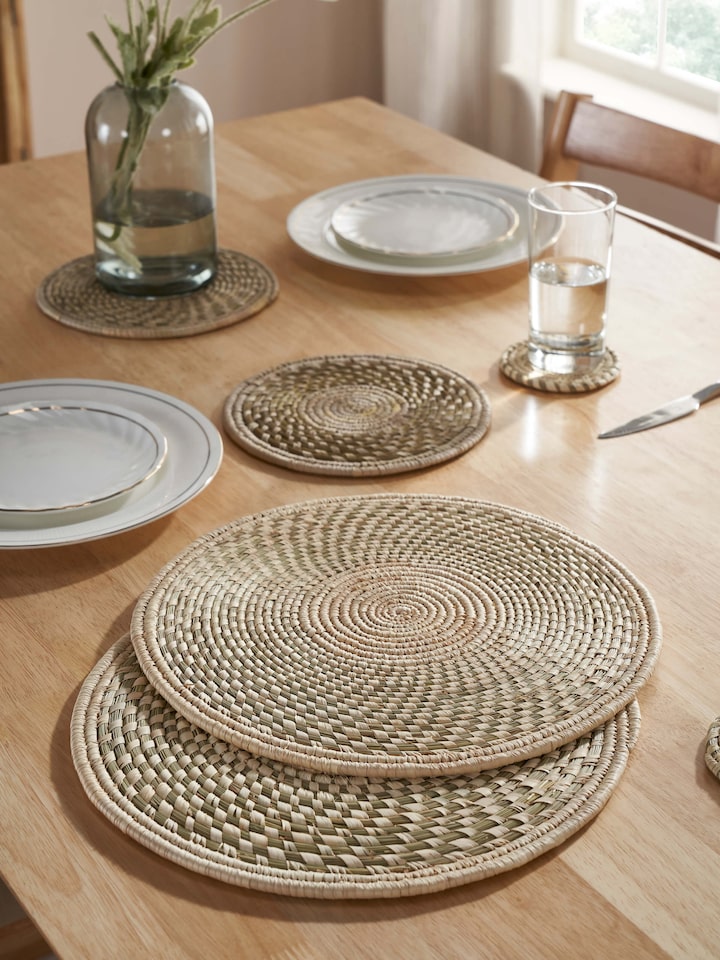 Top view showcasing the solid round shape and light green color of the table mats