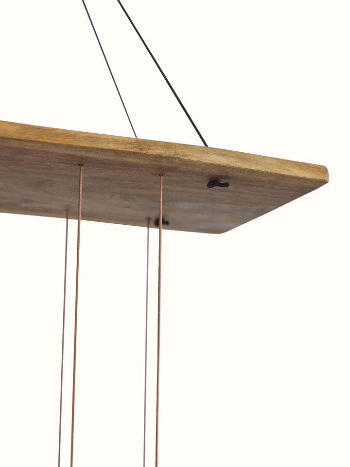 Overhead view of Tranquil Ceramicware Clay Wind Chime highlighting the wind chime’s flowing design