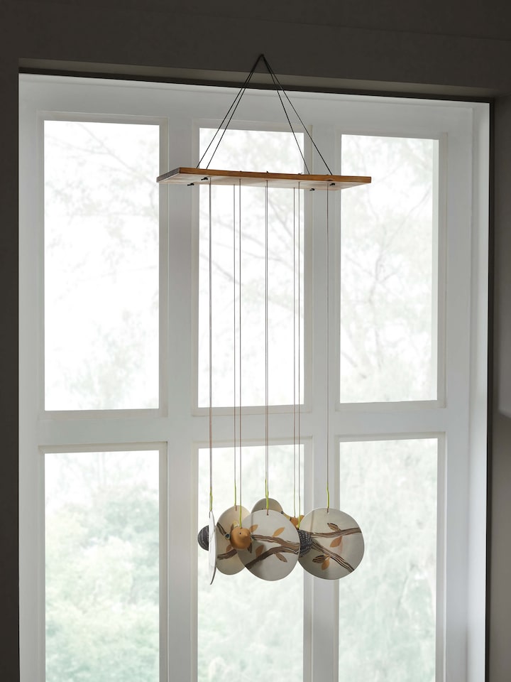 Side view of Tranquil Ceramicware Clay Wind Chime highlighting the artistic clay craftsmanship