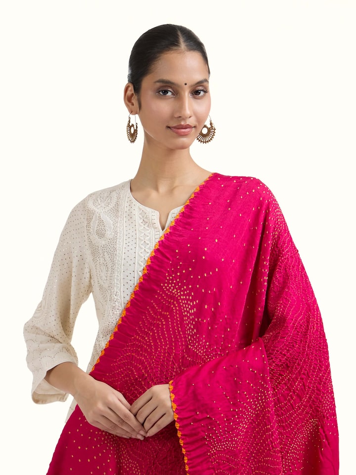 Angled view of Pink Bandhani Tie & Dye Dupatta V revealing the depth of its color and intricate pattern