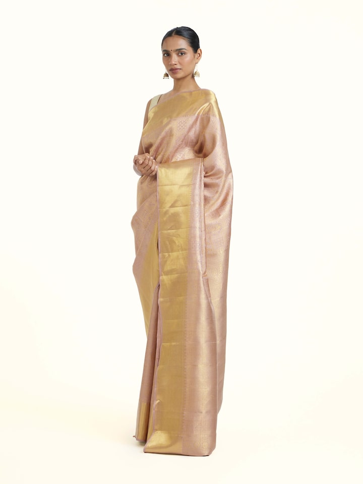 side view of gold kancheepuram silk zari saree drape
