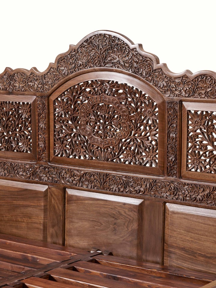 Detail view of Carved Walnut Wood Queen-size Bed highlighting the woodwork and finish detail