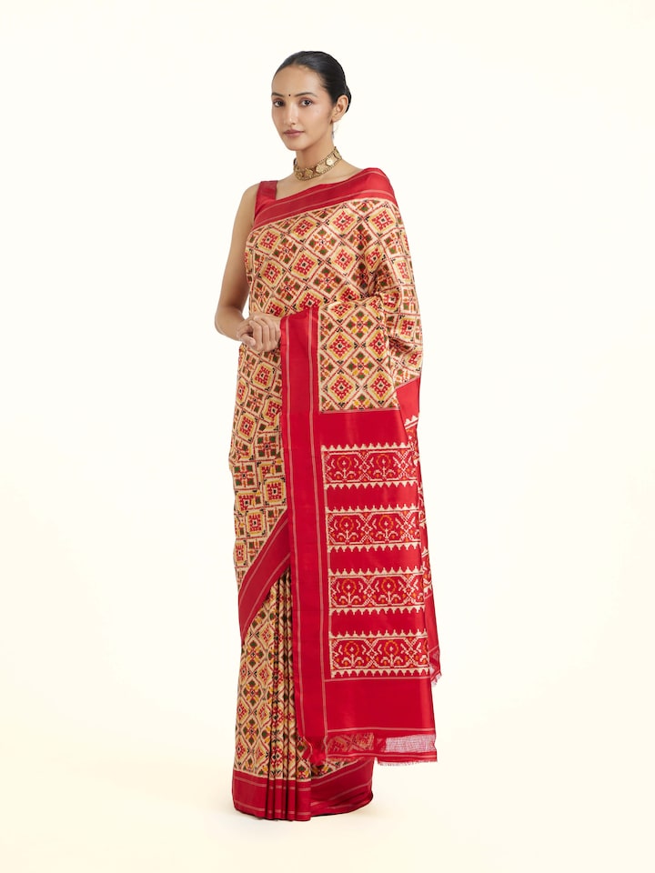 Side view of Cream Pochampally Double Ikat Silk Saree highlighting the detailed craftsmanship and elegant silhouette
