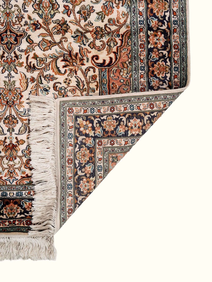 Back view of Traditional Persian Ivory Rust Kashan Kashmir Silk Hand-Knotted Carpet showing the reverse weave