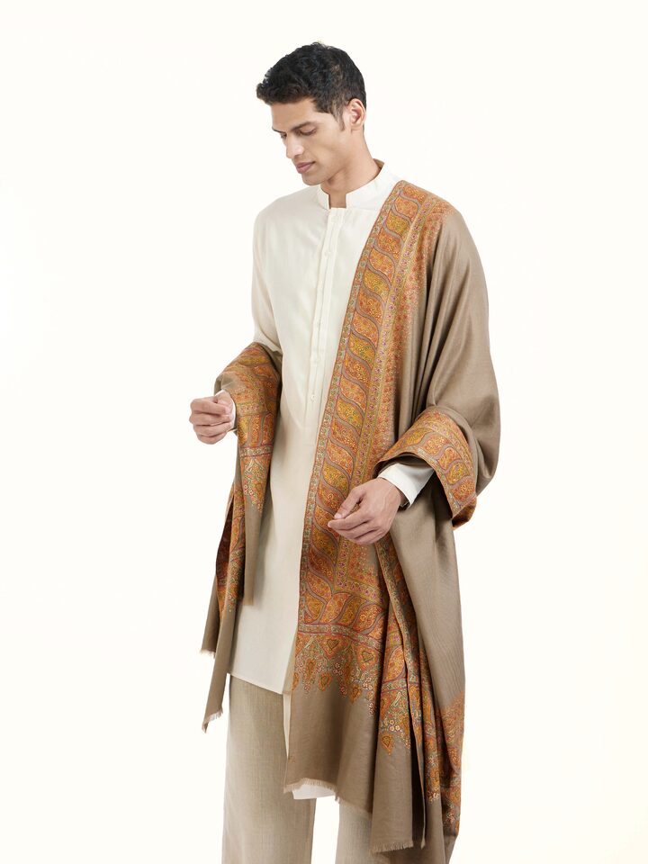 Angled view of Charcoal Sozni Hand Embroidered Shawl revealing the depth of its color and intricate pattern