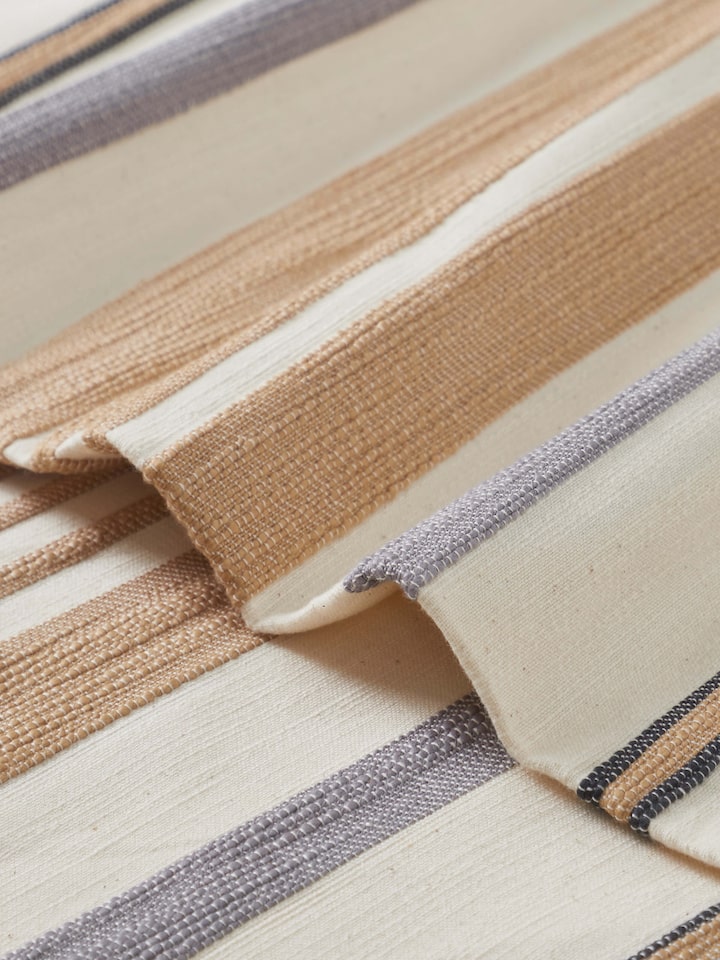 Detailed corner shot highlighting weave and finishing of Neerja handloom cotton bedspread