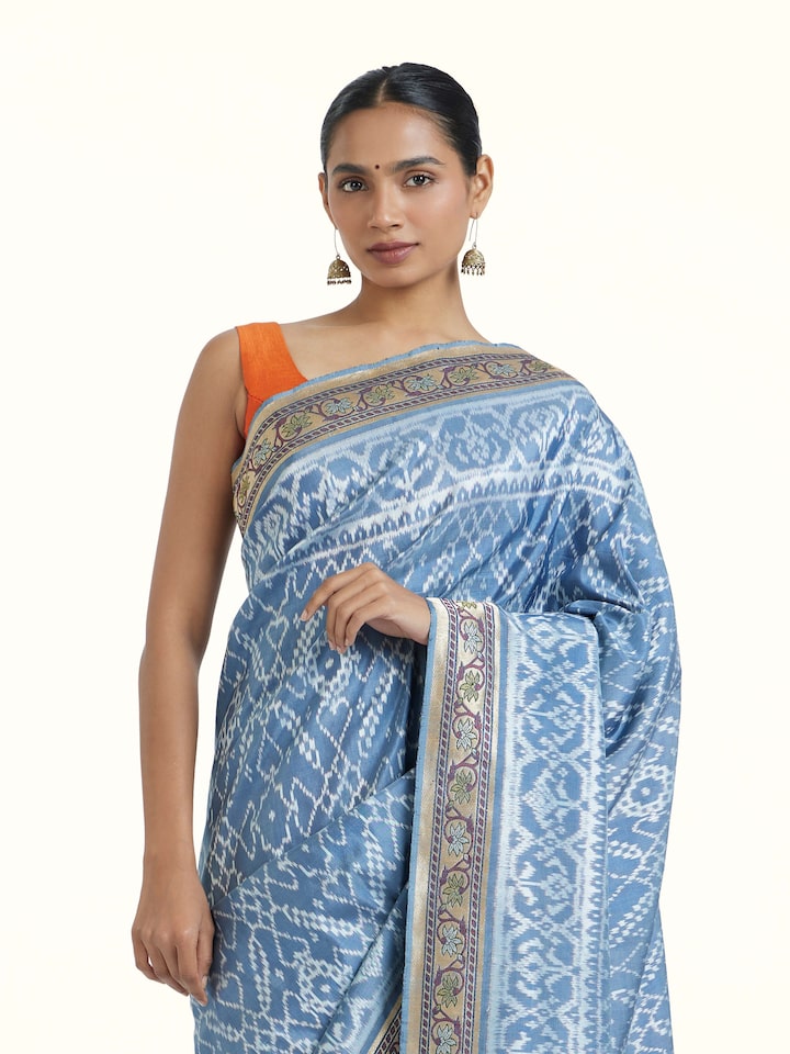 Angled view of Indigo Ashavali Brocade Silk Saree revealing the depth of its color and intricate pattern