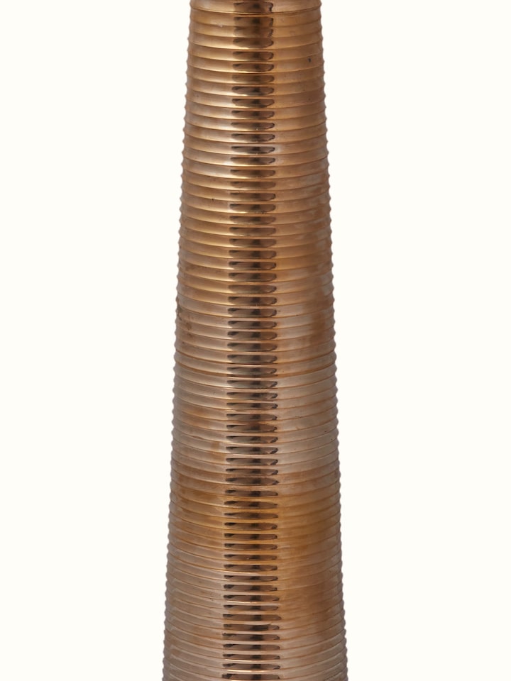 Front view of Vilakku brass stand diya highlighting the diya's elegant design