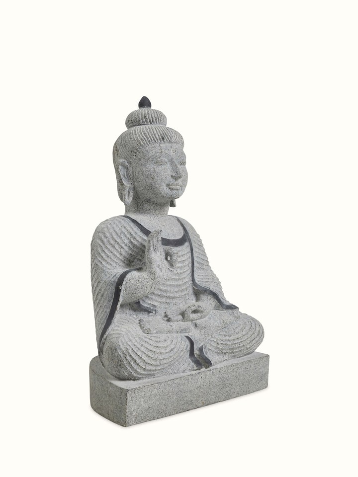 Angled view of the Stone Carved Buddha Idol