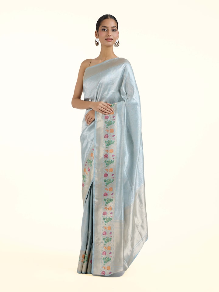 Side view of Ivory Banarasi Kadhwa Silk Saree highlighting the detailed craftsmanship and elegant silhouette