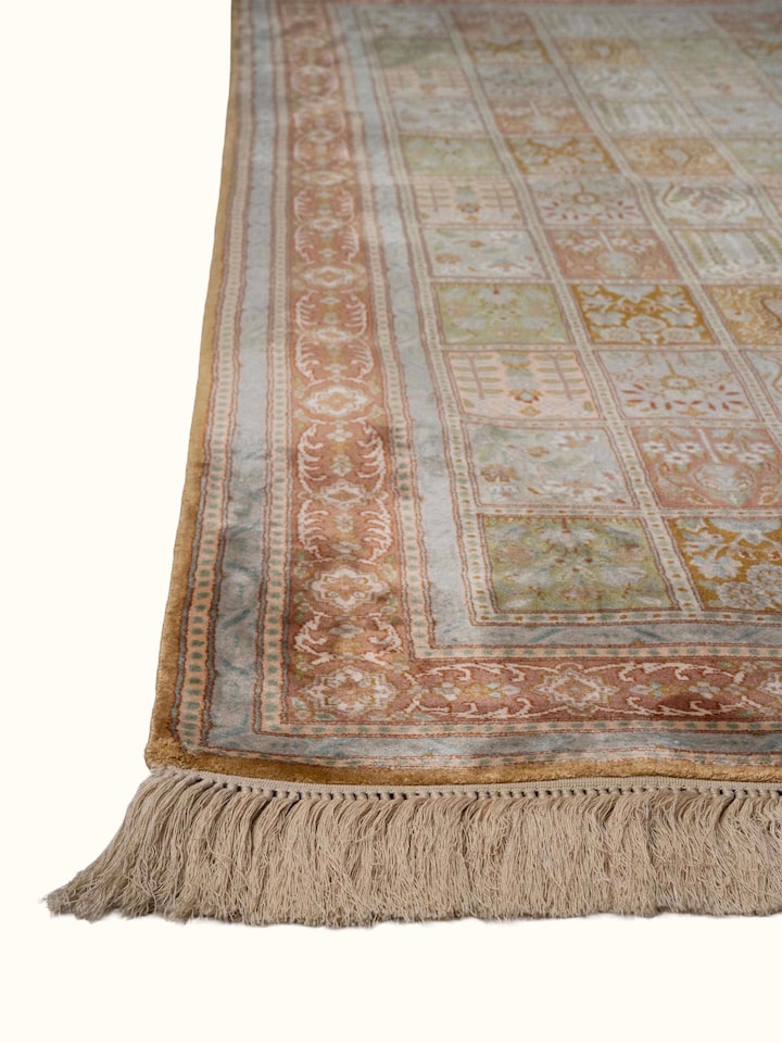 Close-up view of Traditional Persian Green Dabdar Kashmir Silk Hand-Knotted Carpet highlighting the hand-knotted weave and motif detail