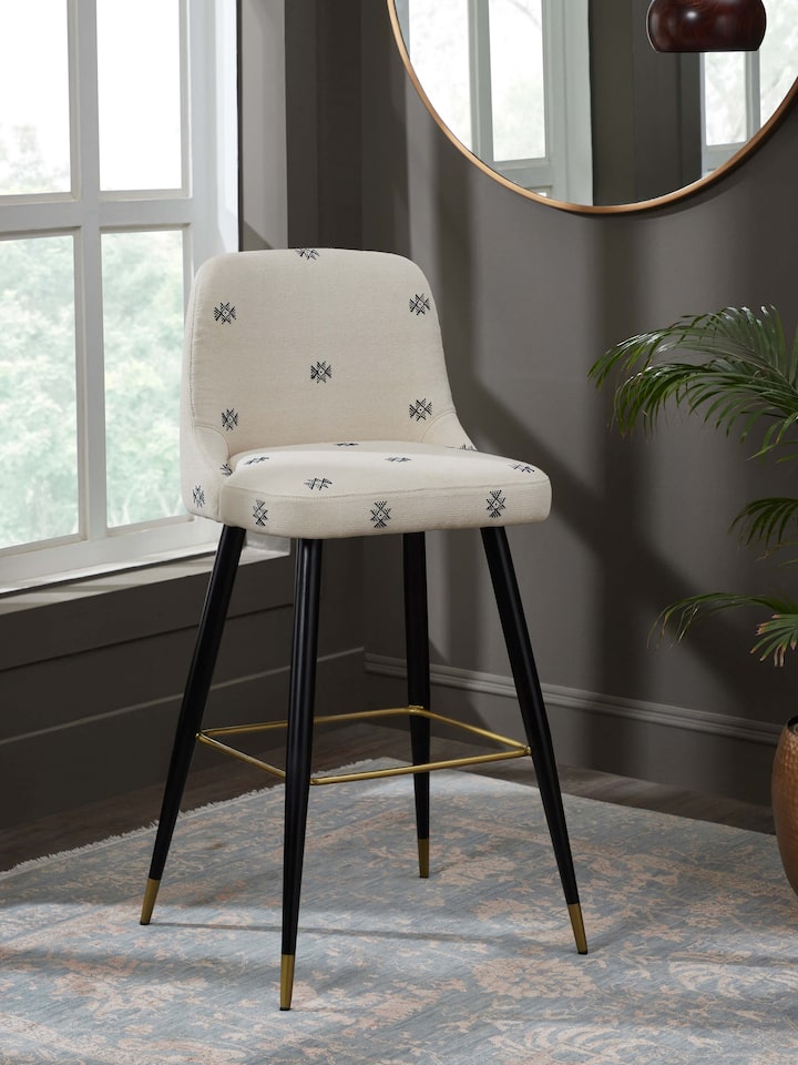 Side view of Upholstered Metal Bar Chair showcasing its elegant design, comfortable seat, and durable metal frame.