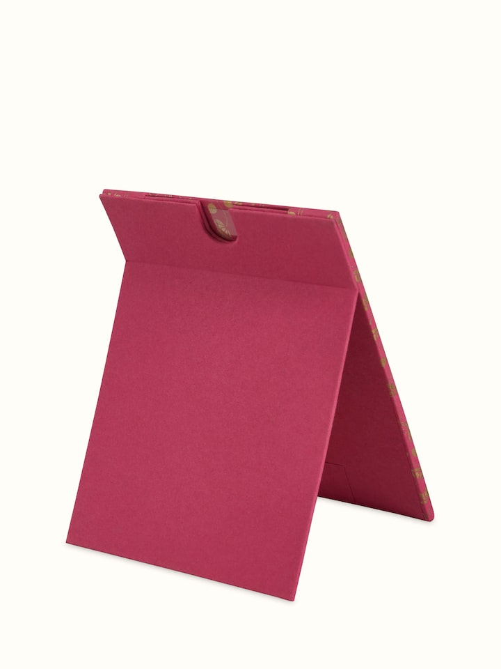 Back view of handmade paper photo frame showing stand and support