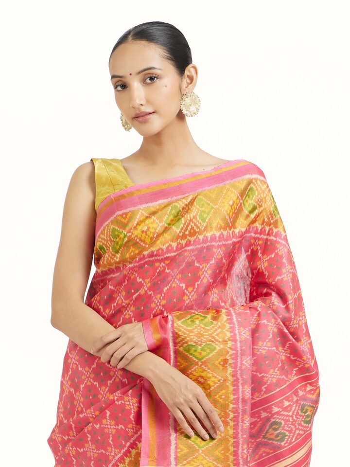 Angled view of Rajkot Patola Ikat Saree revealing the depth of its color and intricate pattern