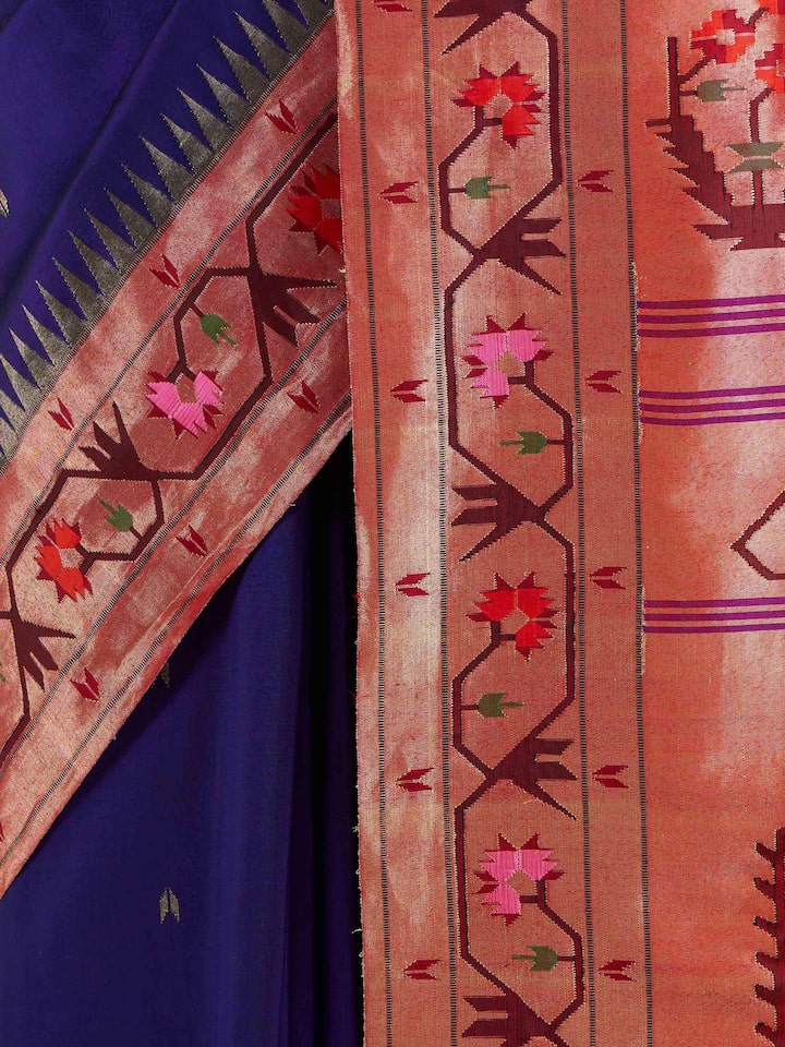 Detail view of blue silk Paithani saree showing silk texture and zari work