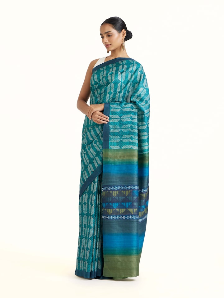 Side view of Sea Green Tussar Silk Discharge Block Printed Saree highlighting the detailed craftsmanship and elegant silhouette