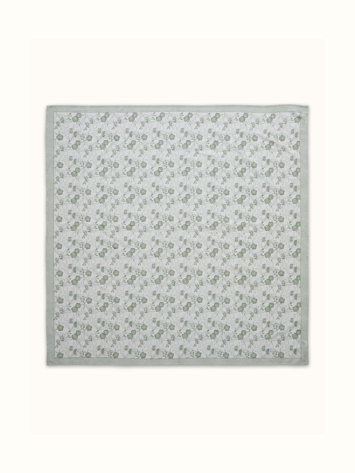 Close-up capturing the intricate block print and fine texture of the cotton linen material