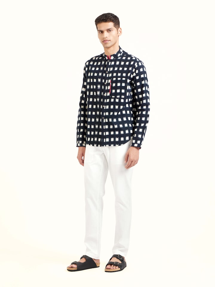 Side view of black cotton Telangana Ikat shirt showcasing relaxed fit