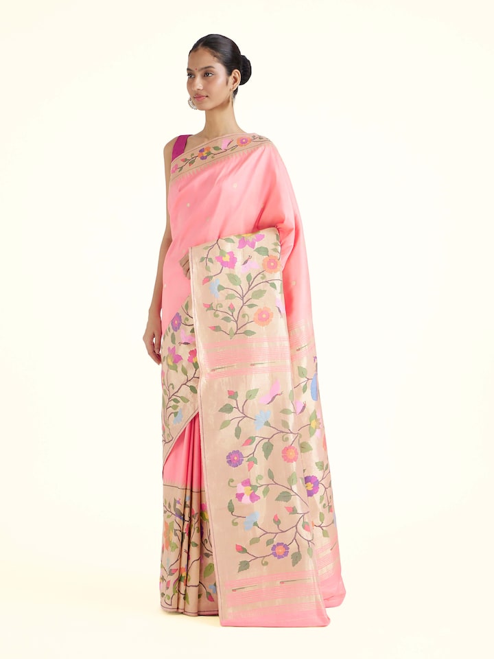 Side view of pink silk Paithani saree showcasing graceful drape