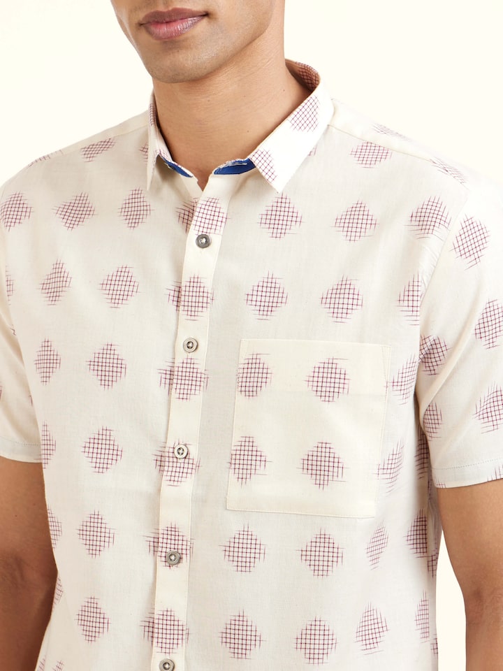 Detail view of white cotton Telangana Ikat shirt showing cotton texture and craftsmanship