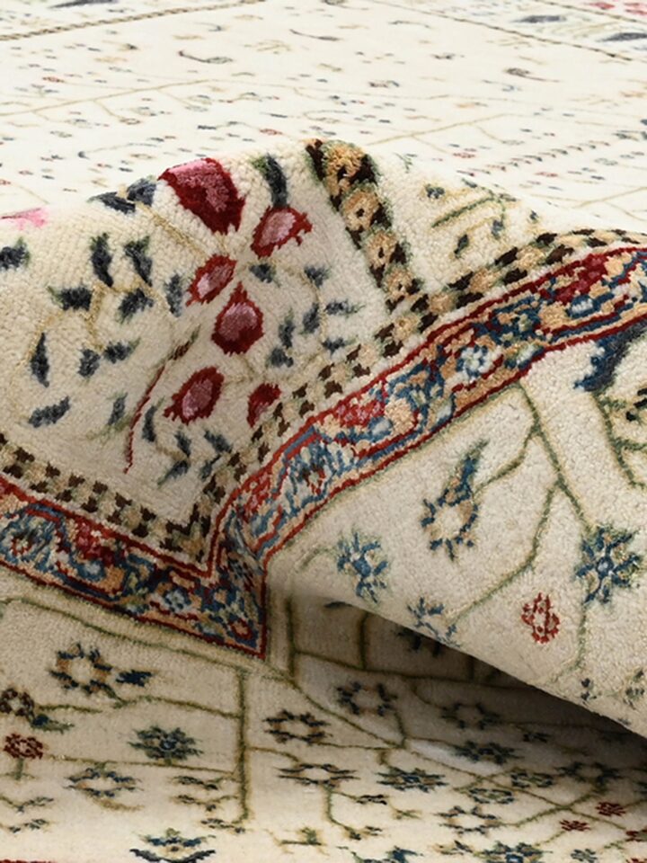 Detail view of Traditional Persian Ivory Tree of Life Bhadohi Wool & Bamboo Silk Hand Knotted Rug highlighting the intricate pattern and pile textu...