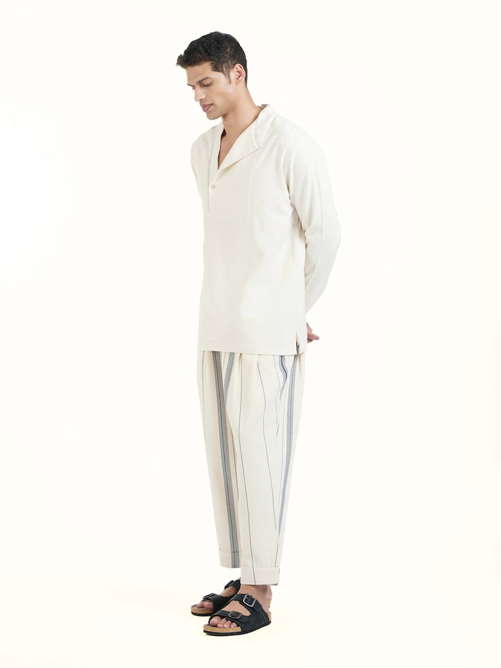Side view of ivory cotton handloom short kurta showcasing relaxed fit