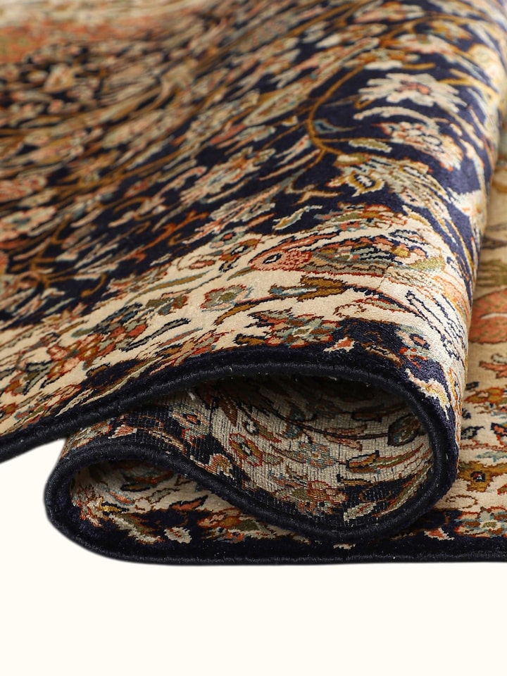 Detailed view of the Traditional Persian Navy Rust Tree of Life Kashmir Silk Hand-Knotted Carpet craftsmanship