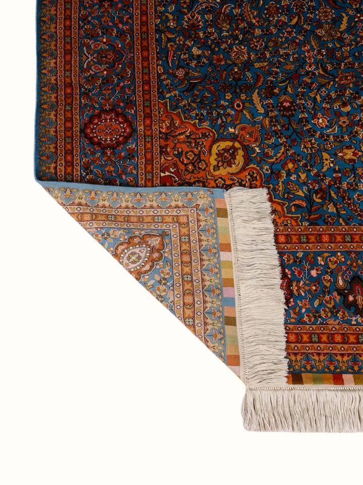 Side-angle view of the Traditional Persian Azure Rust Isfahan Kashmir Silk Hand-Knotted Carpet