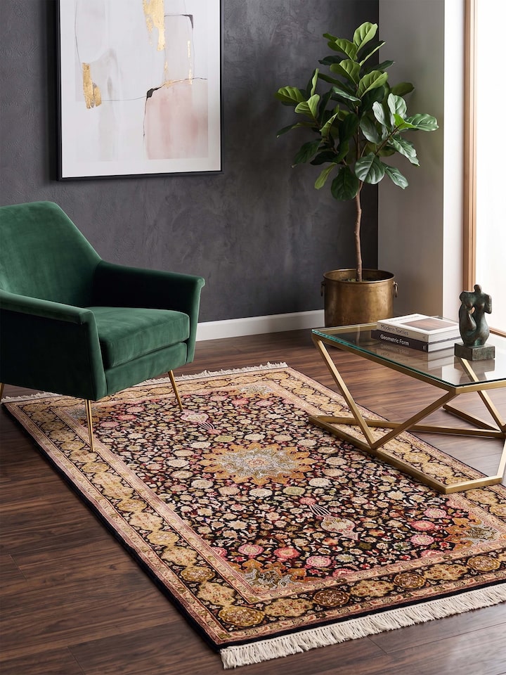 Styled view of Traditional Persian Black Ochre Ardebil Kashmir Silk Hand-Knotted Carpet styled in a room setting