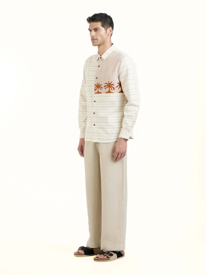 Side view of Ivory Kutchi Embroidered Shirt highlighting the detailed craftsmanship and elegant silhouette