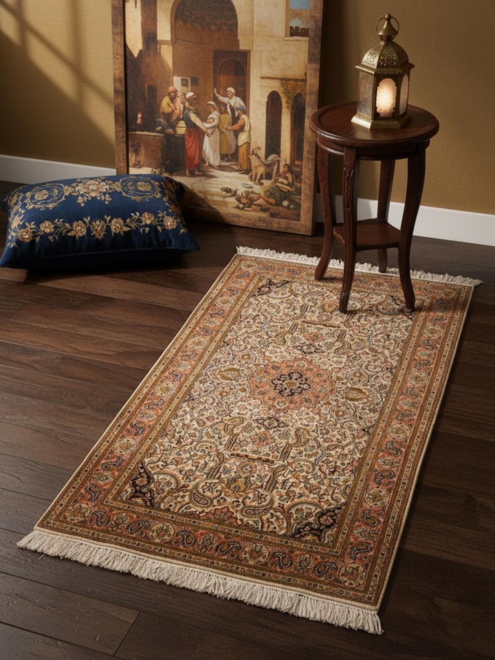 Traditional Persian ivory Tabriz Kashmir silk hand-knotted carpet in living room setting – Swadesh