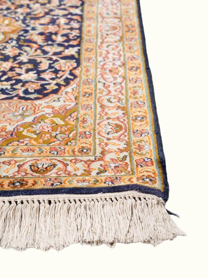 Close-up view of Traditional Persian Navy Green Kashan Kashmir Silk Hand-Knotted Carpet highlighting the hand-knotted weave and motif detail