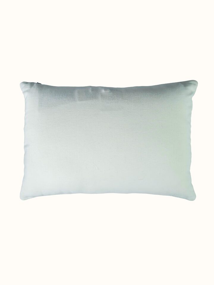 Side-angle view of the Lippan White Pakko Border Hand Embroidered Cotton Cushion Cover