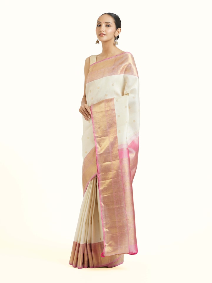 Side view of off-white silk Kancheepuram saree with elegant drape