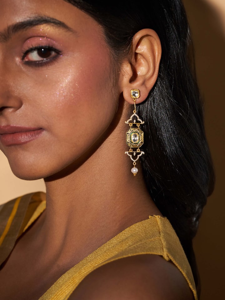 Angled image highlighting the smooth gold finish and shape