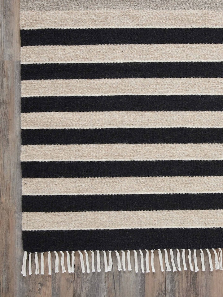 Detailed view of Nomad Stripes Black Beige Jawaja Wool & Cotton Handloom Dhurrie (3x5 ft) focusing on the wool and cotton blend and stripe pattern