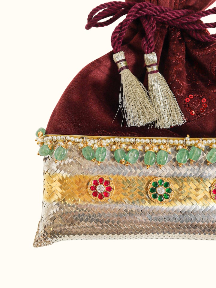 close-up view of silver smithing two-tone potli-style bag design