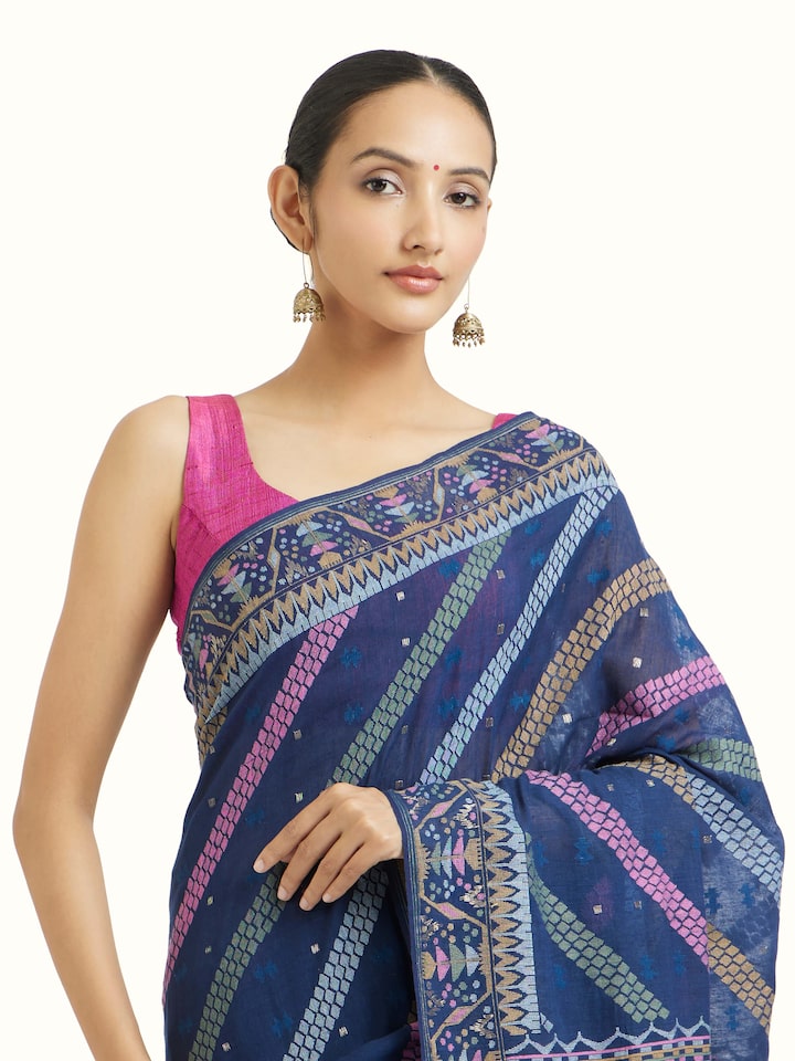 Angled view of indigo cotton Bengal Jamdani saree highlighting jamdani weave