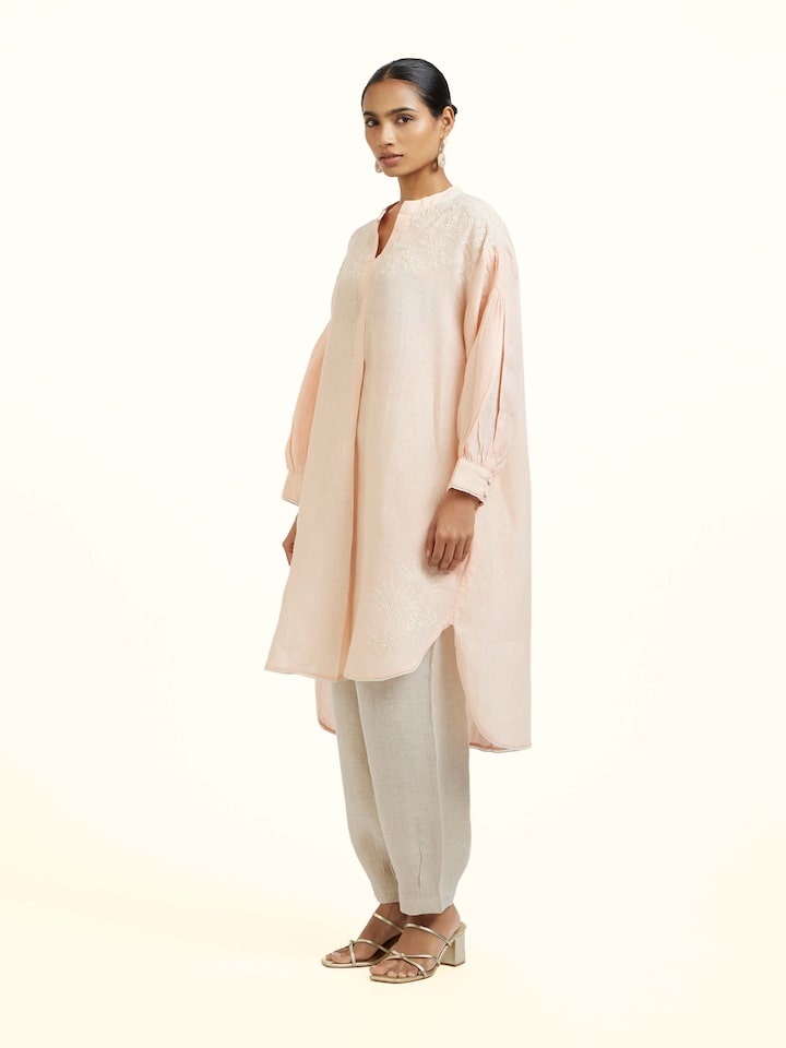 Side view of Peach Linen Chikankari Tunic showing the side fit and silhouette