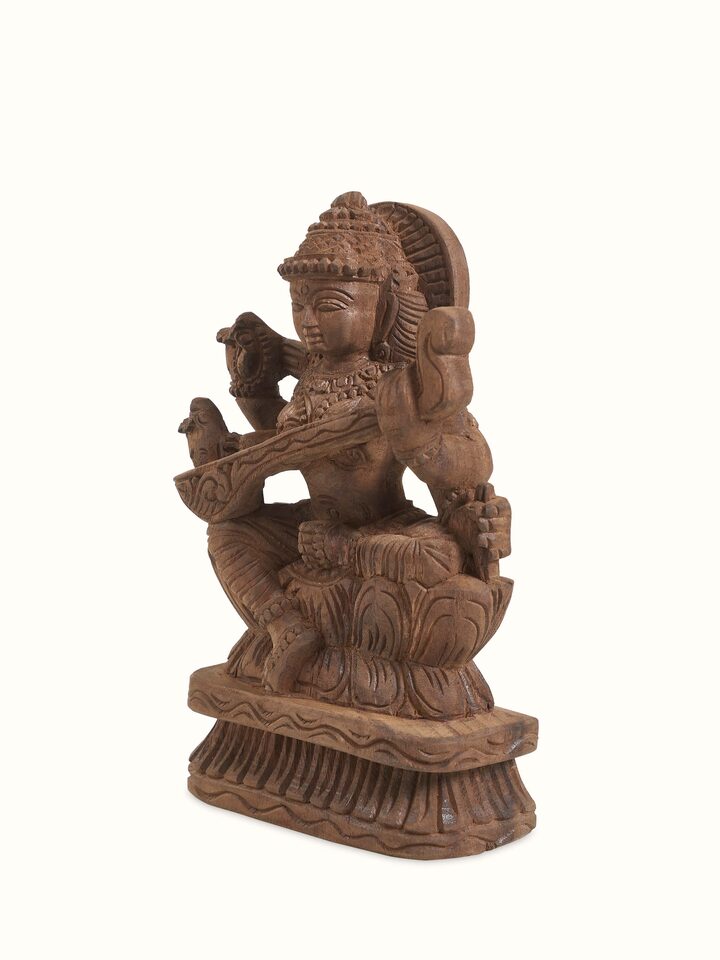 Angled view of the Wood Carved Saraswati Devi Idol