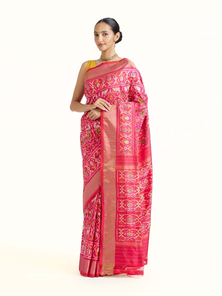 Side view of Light Pink Weft Ikat Silk Saree highlighting the detailed craftsmanship and elegant silhouette