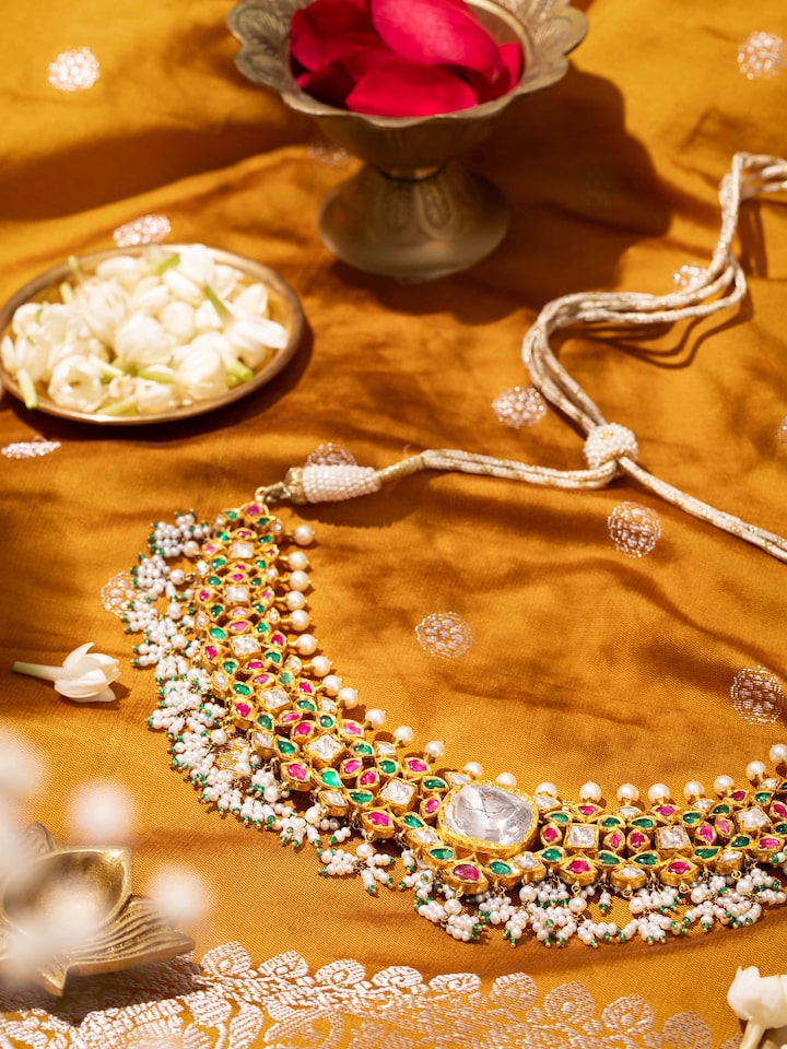 Close-up detail of Jadau gold collar necklace