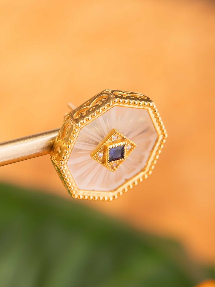 Detail view of Lapidary 14 Karat Gold Studs highlighting the stone setting and metalwork detail