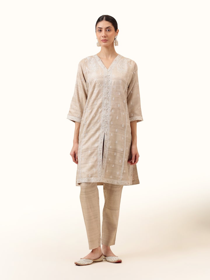 Front view of the beige tussar silk churidar, showcasing its elegant finish and rich silk texture.